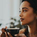 woman drinking tea to calm anxiety