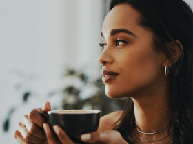 woman drinking tea to calm anxiety