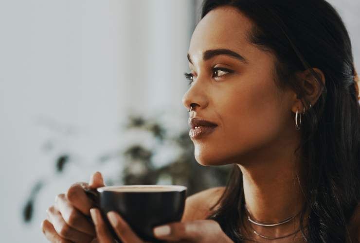 woman drinking tea to calm anxiety