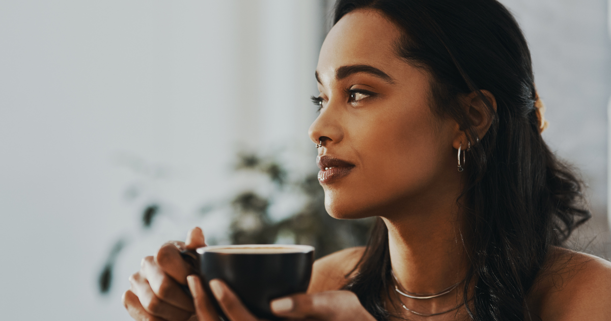 woman drinking tea to calm anxiety